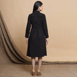 Back View of a Model wearing Black Button Down Cotton Flax Knee Length Formal Dress