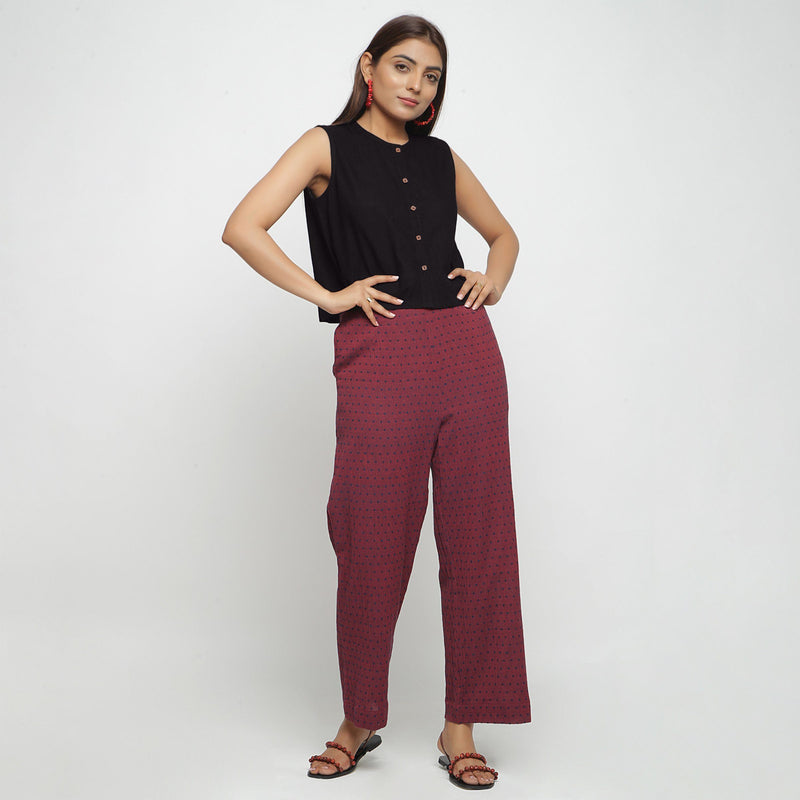 Front View of a Model wearing Black Button-Down Shirt and Polka Dot Pant Set