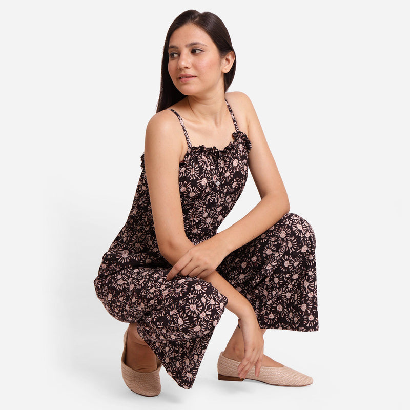 Right View of a Model wearing Black Frilled Neck Floral Camisole Jumpsuit