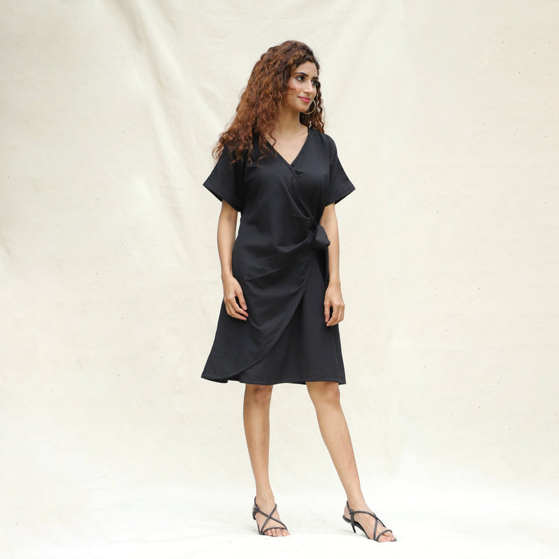 Right View of a Model wearing Black Cotton Flax A-Line Knee Length Wrap Dress