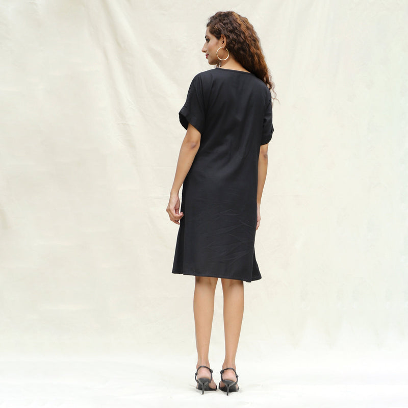 Back View of a Model wearing Black Cotton Flax A-Line Knee Length Wrap Dress