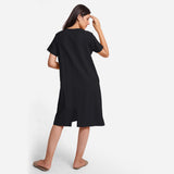 Back View of a Model wearing Black Cotton Flax Anti-Fit Dress