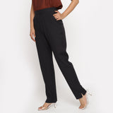 Left View of a Model wearing Solid Black Cotton Flax Straight Pant
