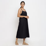 Right View of a Model wearing Black Cotton Flax Strap Sleeve A-Line Dress