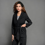 Front View of a Model wearing Black Handspun Cotton Belted Single-Breasted Blazer