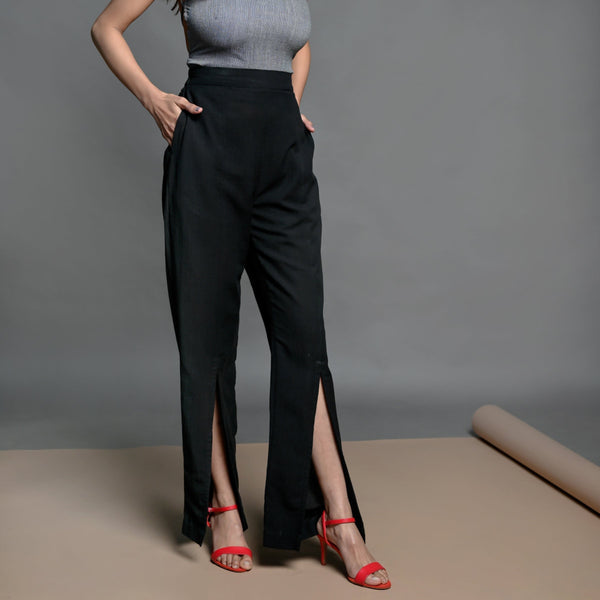 Right View of a Model wearing Black Handspun Cotton Elasticated High-Rise Slit Pant