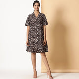 Front View of a Model wearing Block Printed Black Floral Button-Down Dress