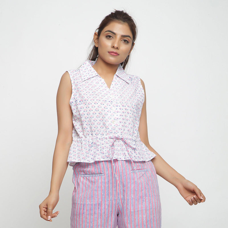 Front View of a Model wearing Block Printed Button-Down Peplum Top