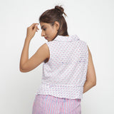 Back View of a Model wearing Block Printed Button-Down Peplum Top