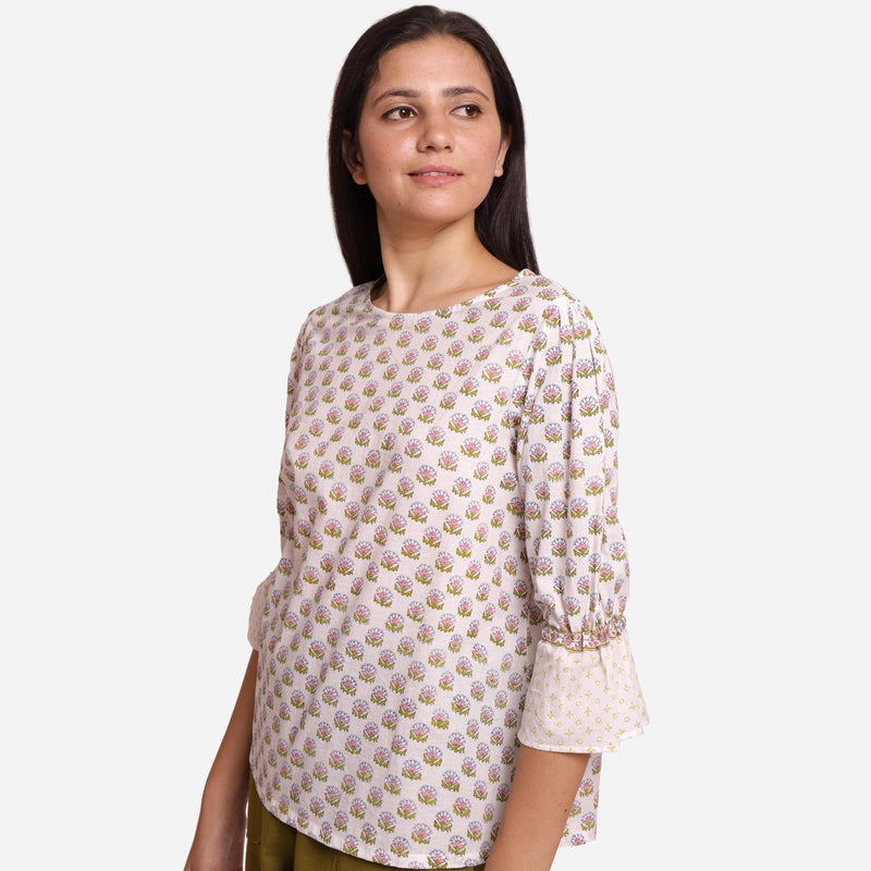Left View of a Model wearing White Block Printed Cotton Frilled Puff Sleeves Top