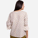 Back View of a Model wearing White Block Printed Cotton Frilled Puff Sleeves Top