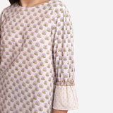 Left Detail of a Model wearing White Block Printed Cotton Frilled Puff Sleeves Top
