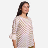 Right View of a Model wearing White Block Printed Cotton Frilled Puff Sleeves Top