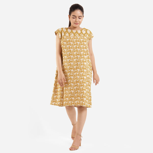 Front View of a Model wearing Mustard Block Printed Cotton Knee Length Yoke Dress