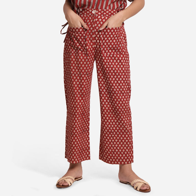 Front View of a Model wearing Brick Red Block Printed Cotton Ankle Length Pant