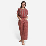 Front View of a Model wearing Brick Red Block Printed Cotton Ankle Length Pant