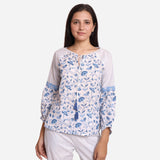 Front View of a Model wearing Blue Floral Block Printed Peasant Cotton Top