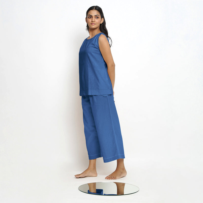 Left View of a Model wearing Blue Boat Neck Top and Powder Blue Pant Set