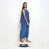 Right View of a Model wearing Blue Boat Neck Top and Powder Blue Pant Set