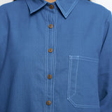 Front Detail of a Model wearing Vegetable Dyed Blue Button-Down Cotton Top