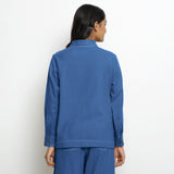 Back View of a Model wearing Vegetable Dyed Blue Button-Down Cotton Top