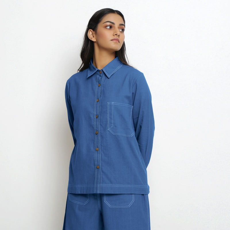 Front View of a Model wearing Vegetable Dyed Blue Button-Down Cotton Top