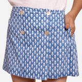 Front Detail of a Model wearing Blue Block Printed Button-Down Skirt