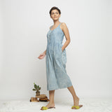 Left View of a Model wearing Blue Dabu Printed Button-Down Jumpsuit