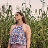 Front View of a Model wearing Blue Floral Halter Neck Short Top
