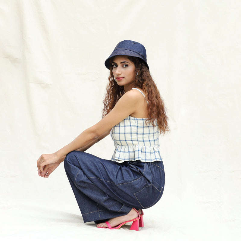 Left View of a Model wearing Blue and Off-White Checks Vegetable Dyed Handspun Cotton Peplum Wrap Top