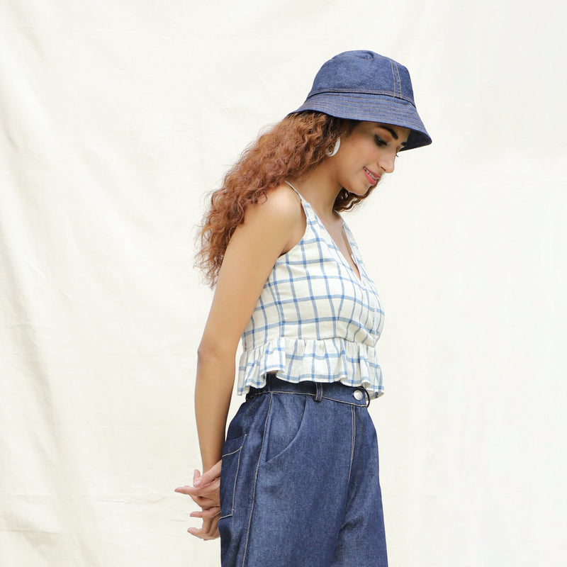 Right View of a Model wearing Blue and Off-White Checks Vegetable Dyed Handspun Cotton Peplum Wrap Top