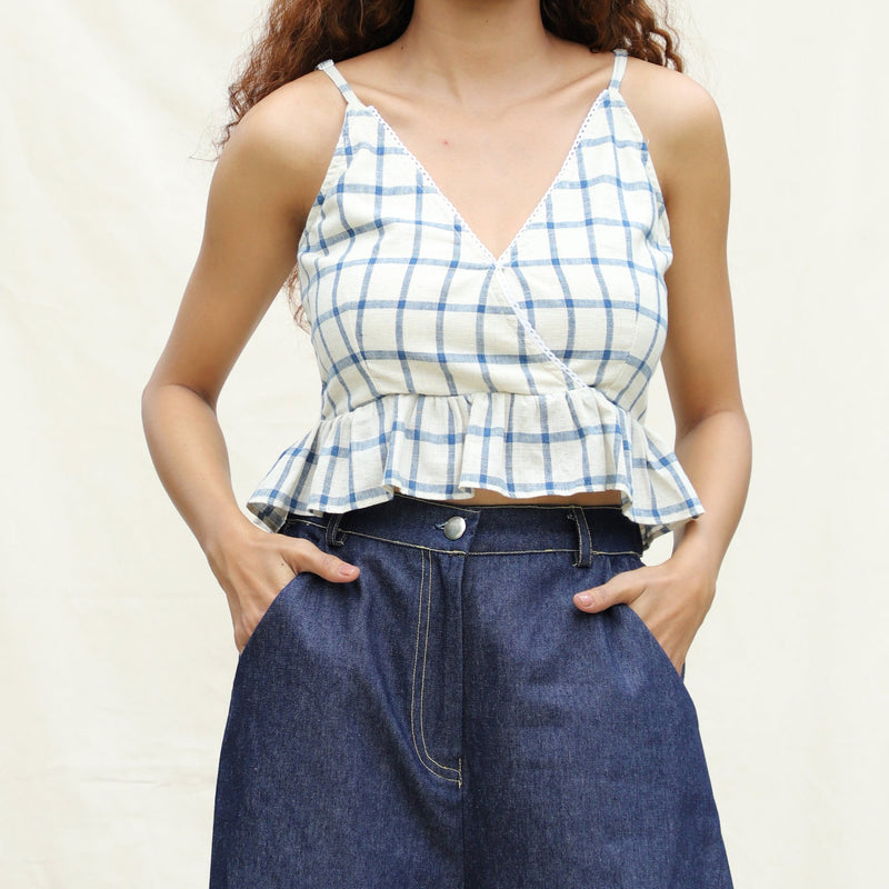 Front Detail of a Model wearing Blue and Off-White Checks Vegetable Dyed Handspun Cotton Peplum Wrap Top