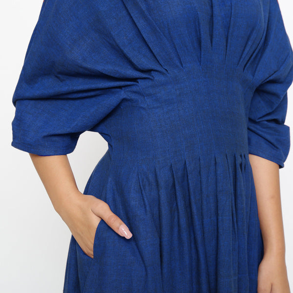 Front Detail of a Model wearing Blue Solid Boat Neck Flared Dress