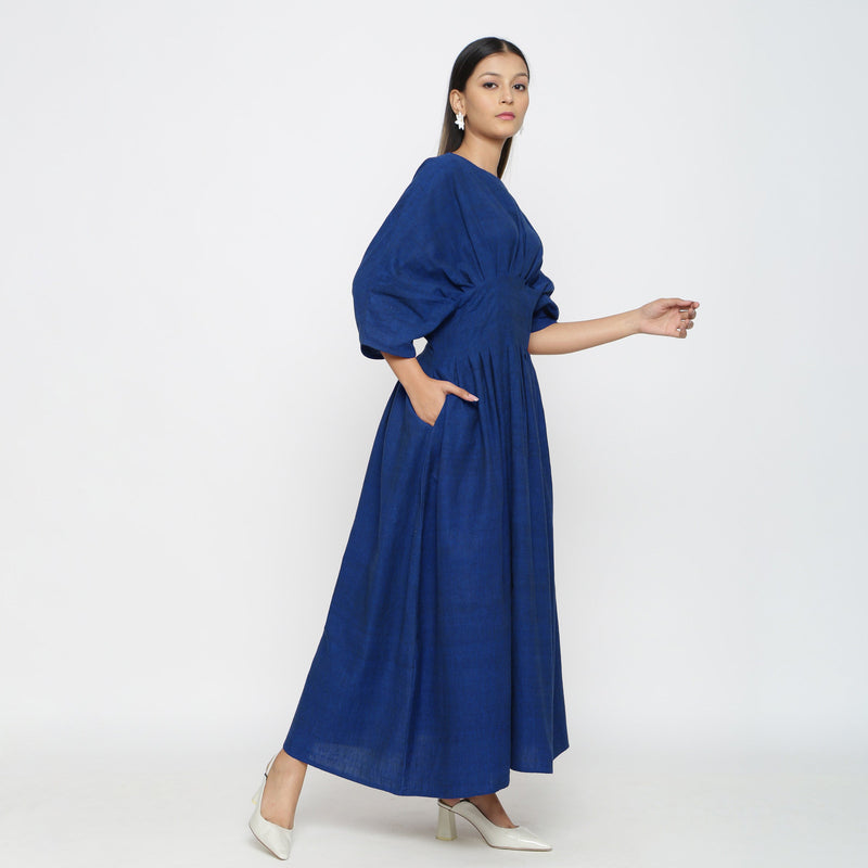 Right View of a Model wearing Blue Solid Boat Neck Flared Dress