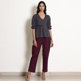 Front View of a Model wearing Blue Striped Wrap Top and Warm Wine Pant Set