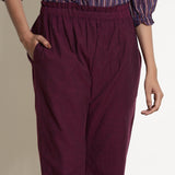 Front Detail of a Model wearing Warm Berry Wine Frilled Waist Tapered Pant