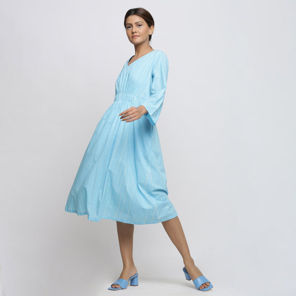 Left View of a Model wearing Blue Tie-Dye Cotton Midi Fit and Flare Dress