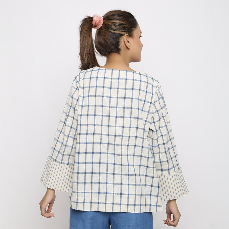Back View of a Model wearing Off-White and Blue Vegetable Dyed Handspun Cotton Asymmetrical V-Neck Outerwear