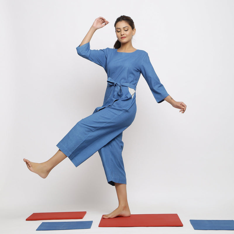 Left View of a Model wearing Blue Vegetable Dyed Straight Jumpsuit
