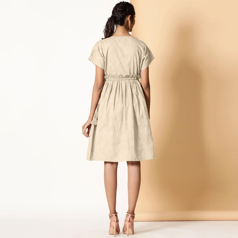 Back View of a Model wearing Bohemian Cotton Beige Frilled Dress