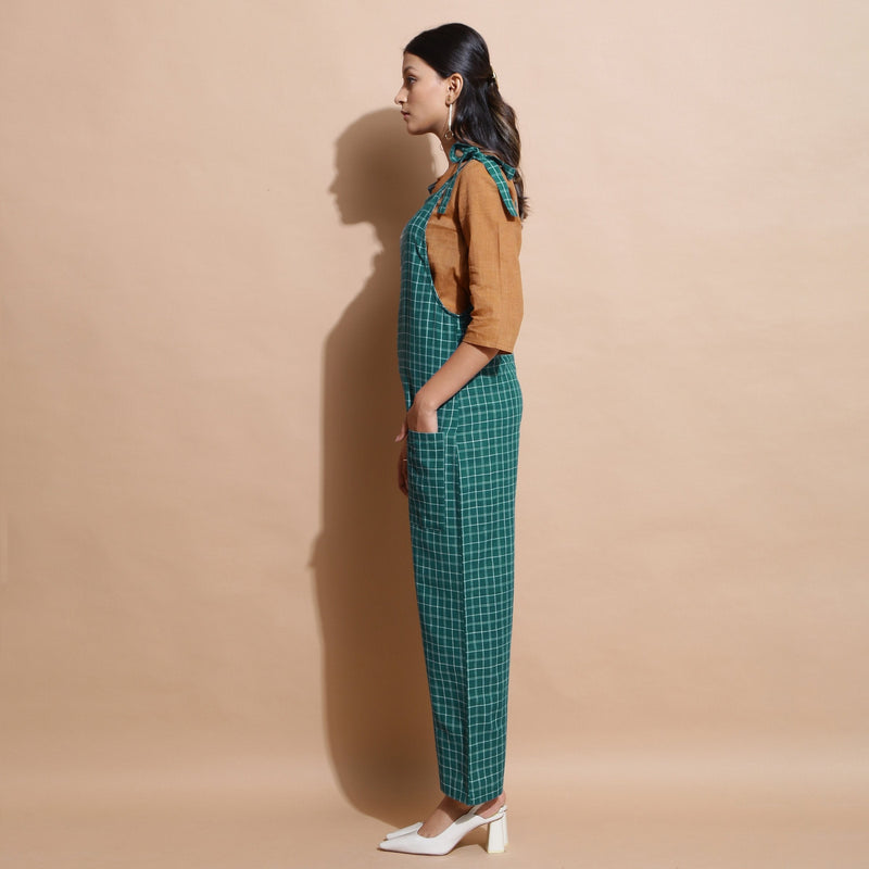 Left View of a Model wearing Bottle Green Cotton Ankle-Length Dungaree
