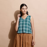 Front View of a Model wearing Bottle Green Cotton Sleeveless Top