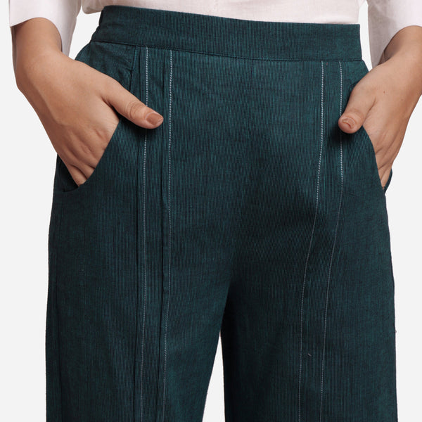Front Detail of a Model wearing Bottle Green Mid-Rise Straight Fit Pant