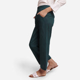Left View of a Model wearing Bottle Green Mid-Rise Straight Fit Pant