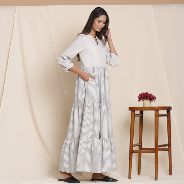 Right View of a Model wearing Cloudy Grey Striped Floor Length Cotton Tier Dress