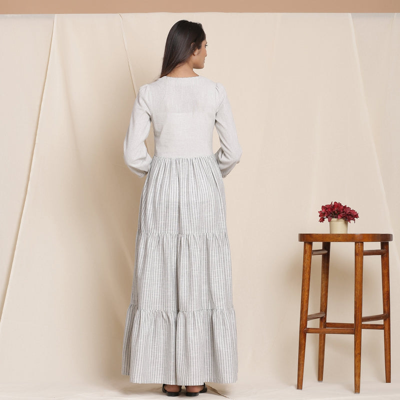 Back View of a Model wearing Cloudy Grey Striped Floor Length Cotton Tier Dress