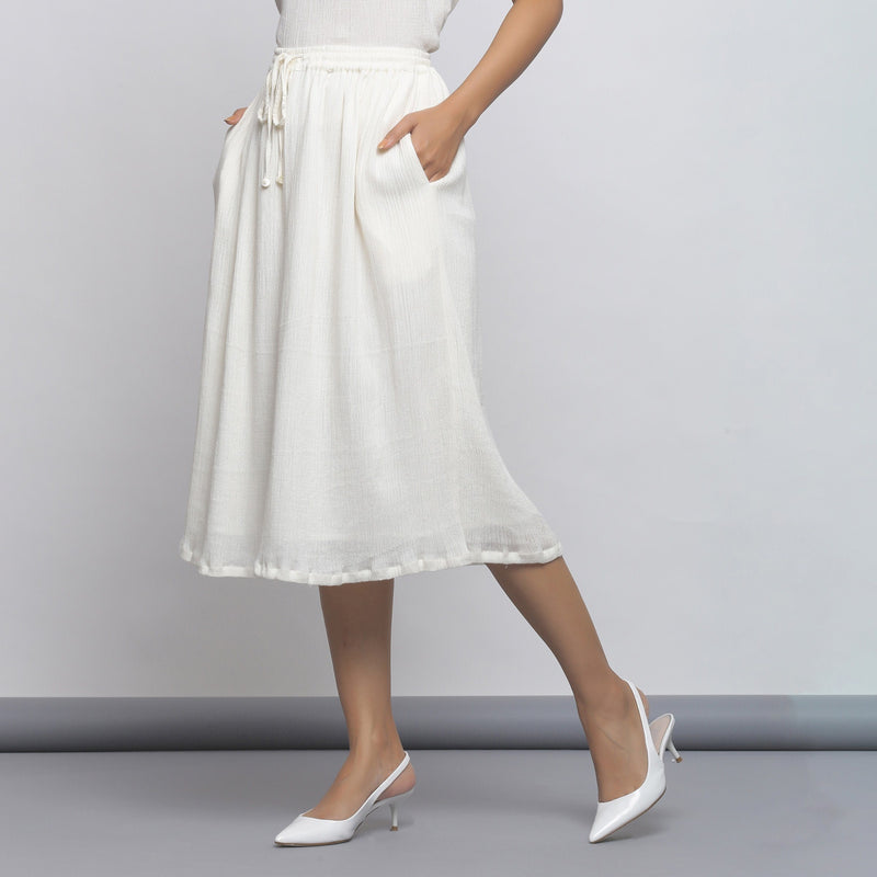 Left View of a Model wearing Off-White Crinkled Cotton Flared Skirt