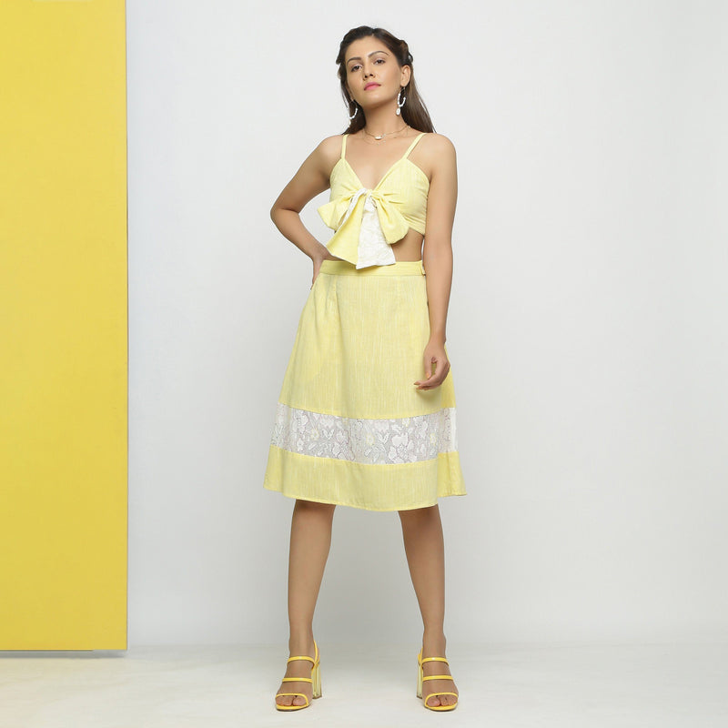 Front View of a Model wearing Lacy Yellow Tube Top and A-Line Skirt Set
