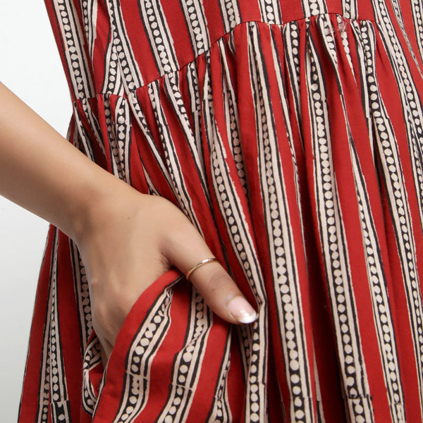 Close View of a Model wearing Brick Red Bagru Asymmetrical Midi Dress