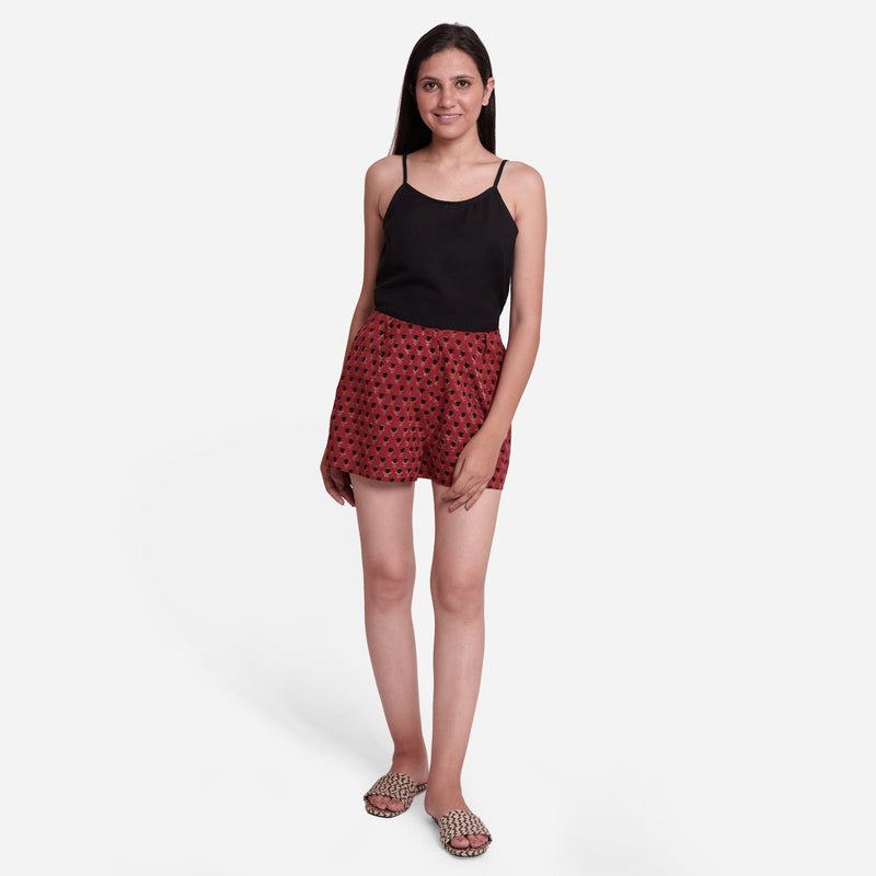 Front View of a Model wearing Brick Red Block Print Floral Hot Pants